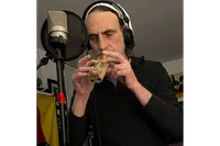 Andrew Leonard playing harmonica